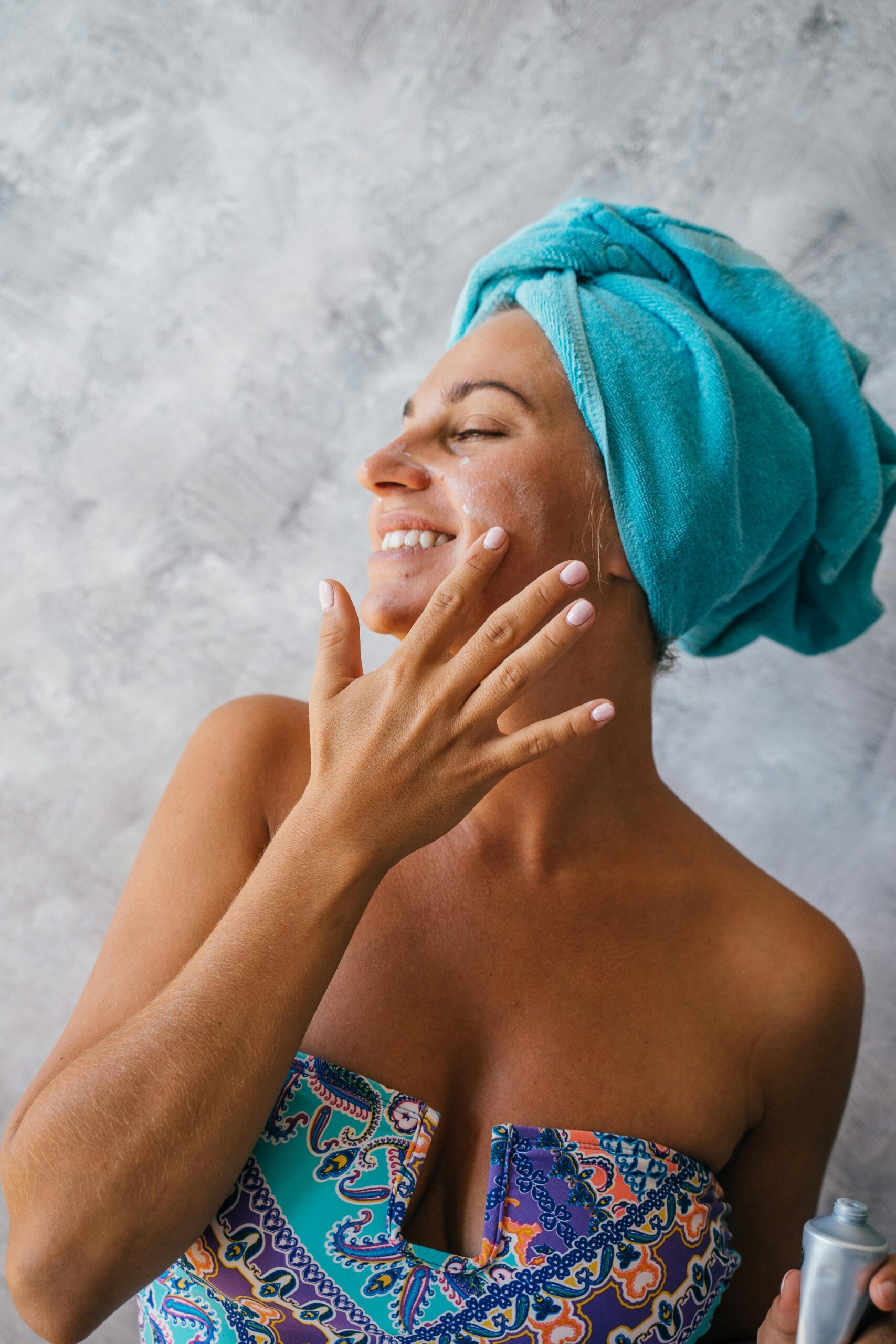 Best sunscreen for anti-aging in your 30s — woman applying SPF as part of morning skincare routine